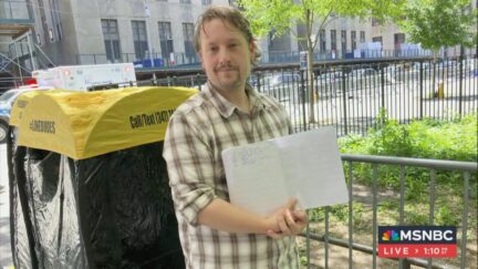 man waiting in line to attend Trump trial