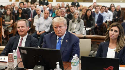 Trump seated at table with his attorneys, including Alina Habba to his left, for NY fraud case