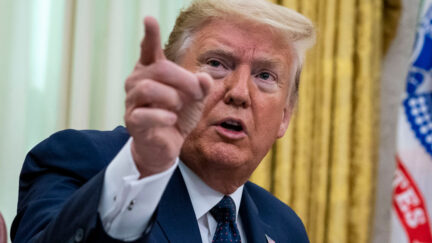 Donald Trump points in Oval Office